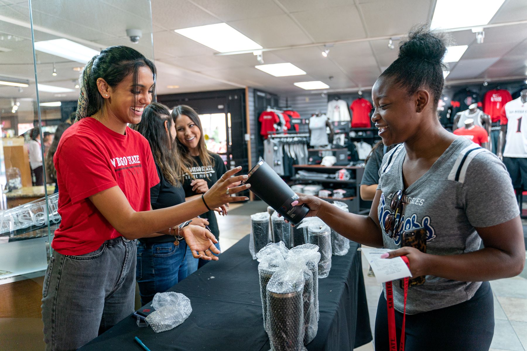 Students are checking out merchandises at the bookstore